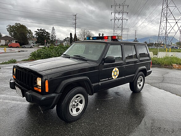 Rent a POLICE CAR: VINTAGE JEEP CHEROKEE SHERIFF CHARACTER